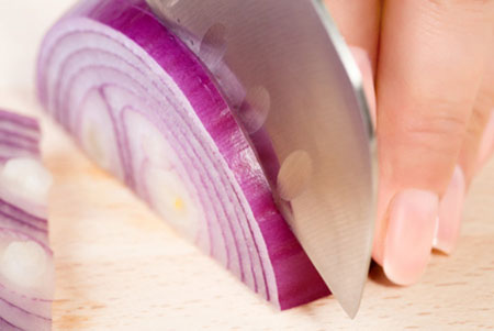 woman-cutting-onion-horiz_lxxm6t
